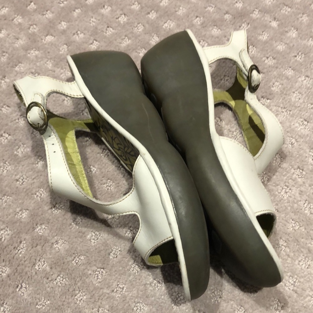 Fly London white leather buckle up wedge sandals.